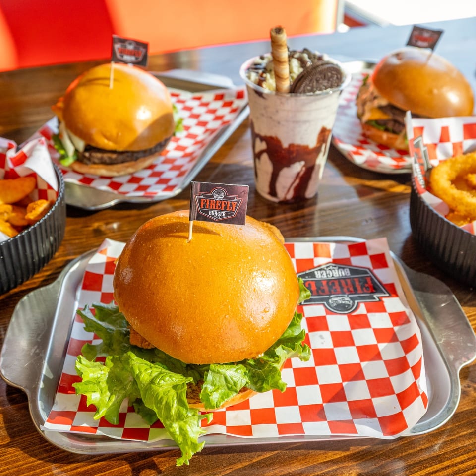 Firefly burgers and shake at a dining table