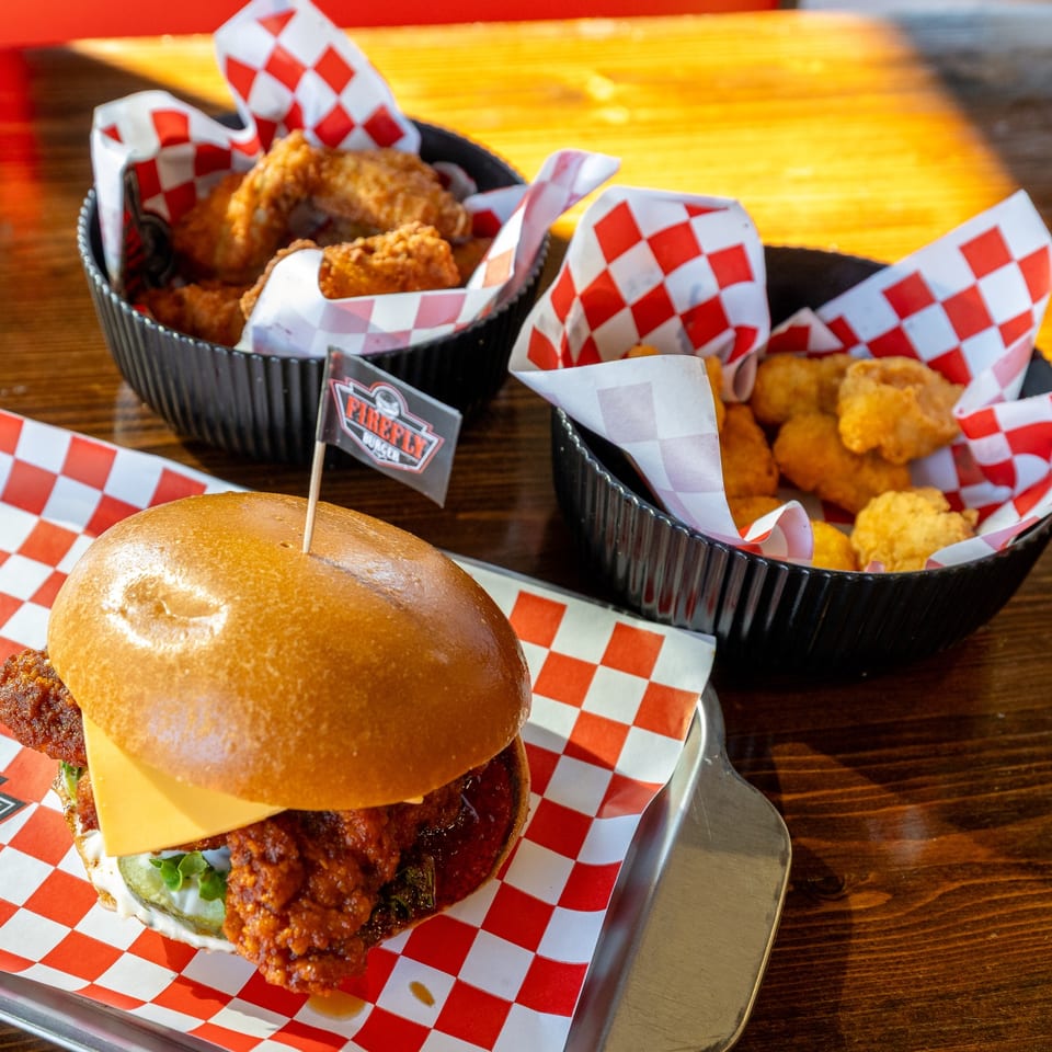 Burger, wings and nuggets at the table